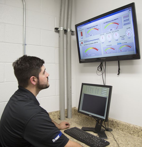 Technician Matt Parker views display screen readouts. 