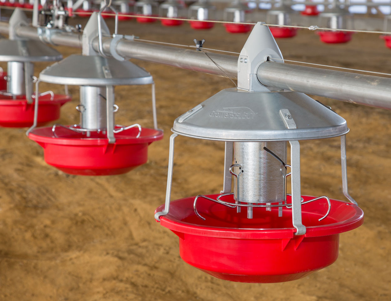 The two piece design of the GrowerSELECT Adult Turkey Feeder allows it to be easily installed on feed line pipes and the high-density polypropylene removable top reduces damage to auger tubes common with traditional metal drop tube tops. 