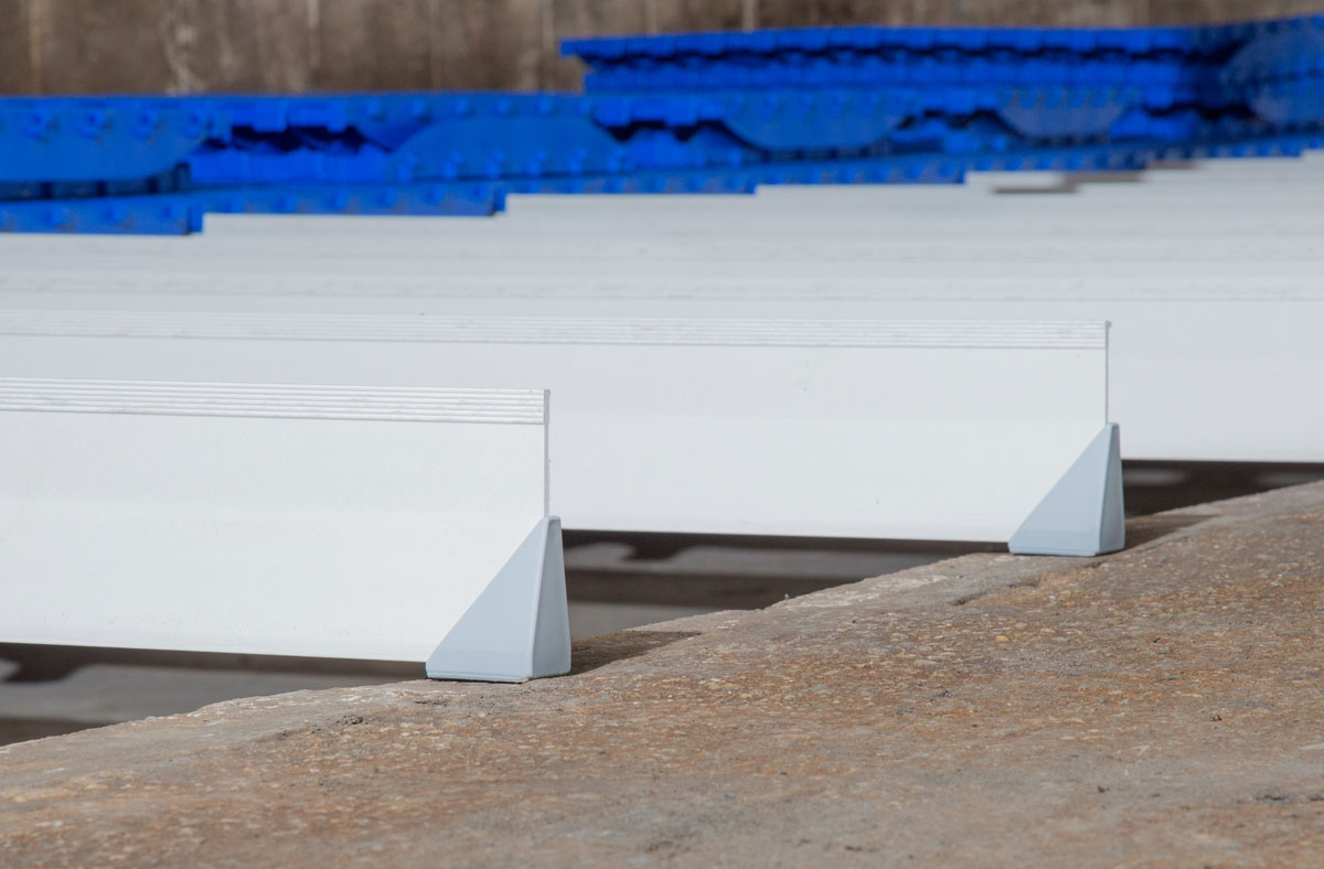 DUO support beams are constructed of a corrosion resistant fiberglass composite and are triangularly shaped to help prevent manure build up while providing strong support for both nursery and farrowing floor installations. End cap pedestals seal beam-end openings and provide additional stabilization.