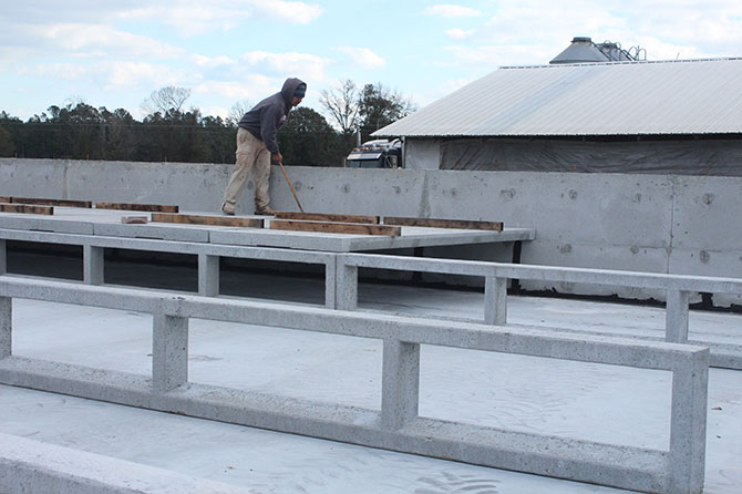 Hog Slat pre-cast pier walls allow faster installation of slat flooring in shallow pit style barns because both the piers and slats can be installed at the same time.