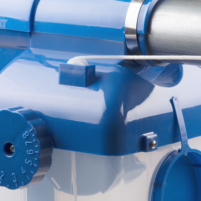 A nylon guide wheel provides smooth activation of the feed drop ball on the Center Drop feeder.