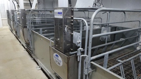 Galvanized farrowing crate with SowMAX Ad Lib dispensers.  